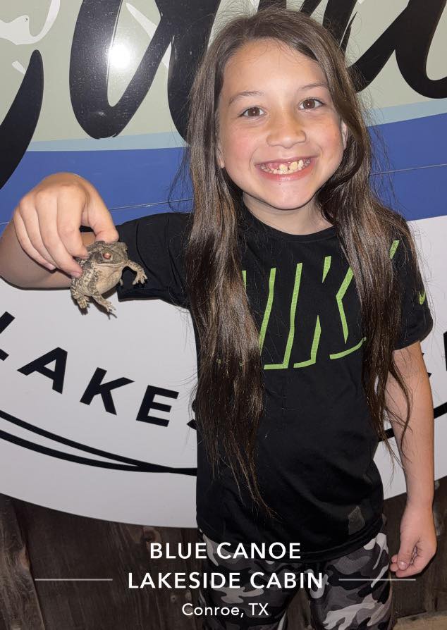 Catching a frog makes a young man smile!