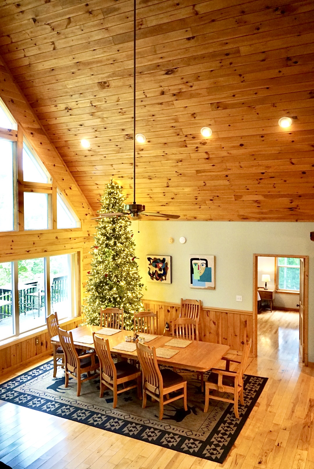 Dining Room: Gather around the spacious table, adorned with art and a festive tree for joy!
