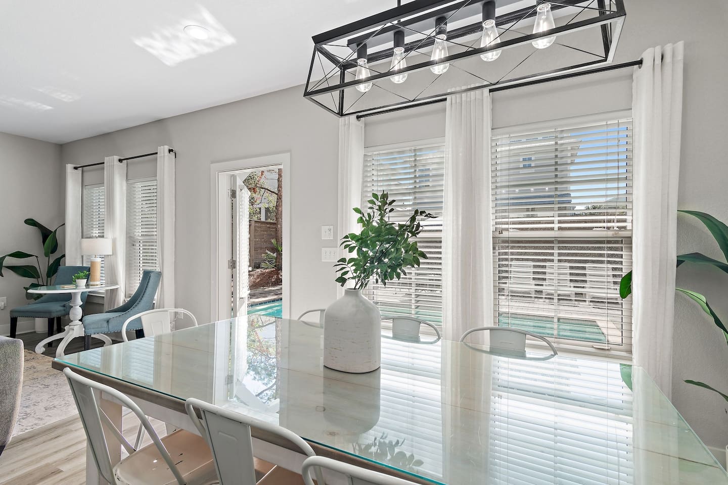 Custom glass dining table with seating for eight.
