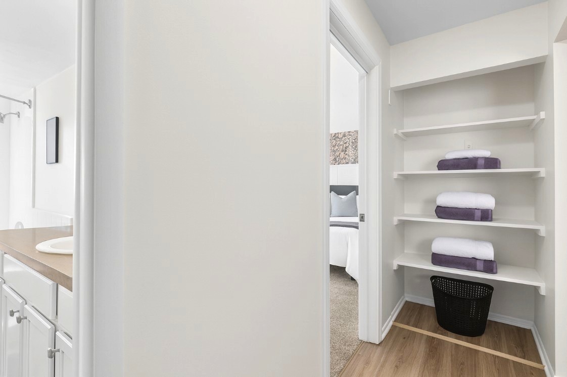 Spacious closet with shelving to keep your belongings organized during your stay.