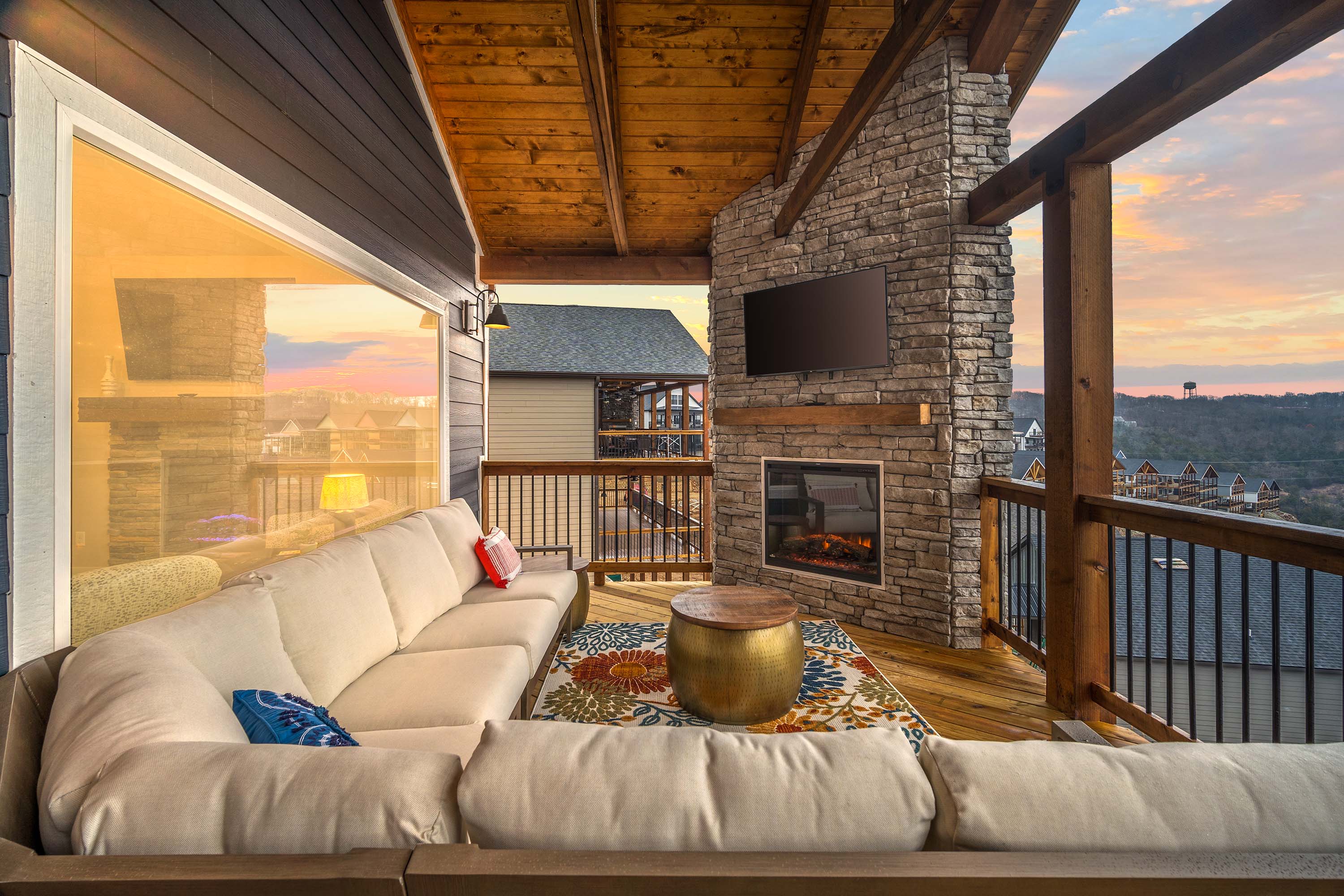 Upper deck sitting area seats eight, outdoor fireplace and TV