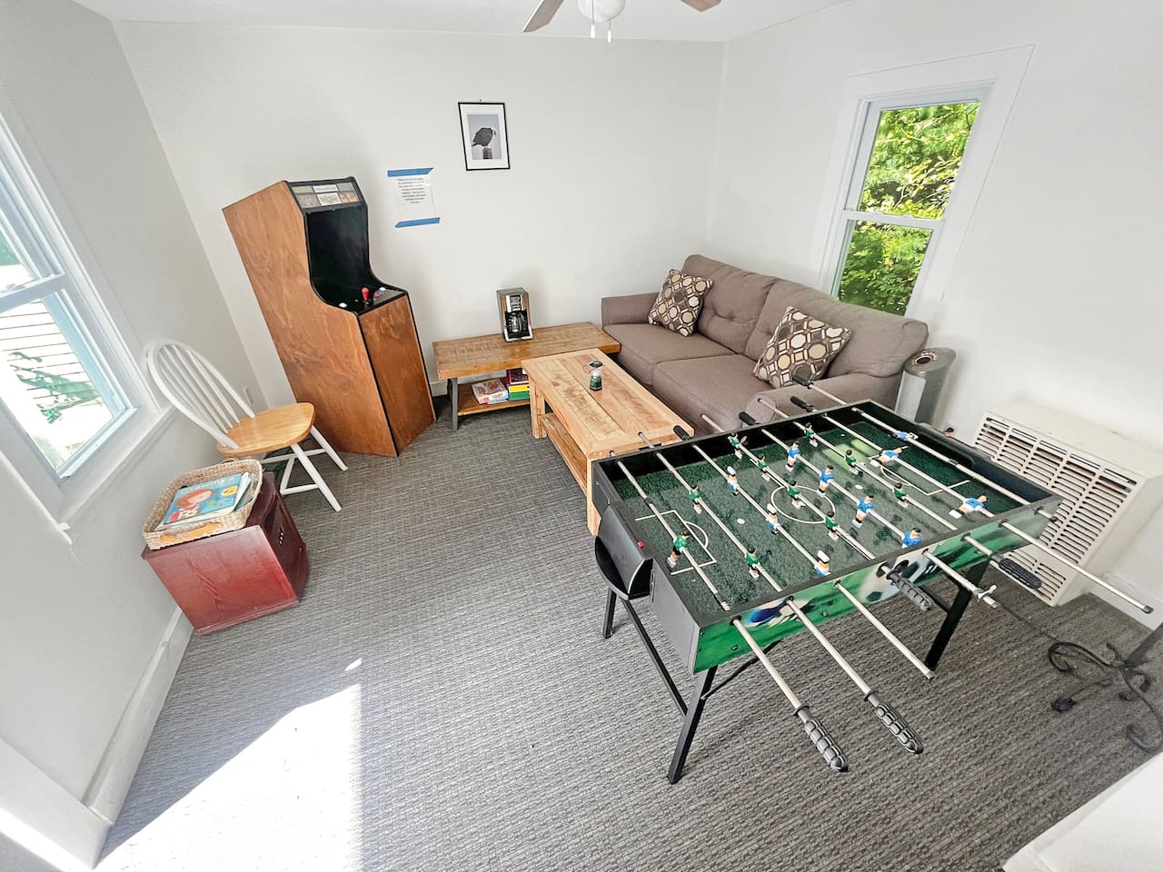 Fully stocked game room with foosball table, arcade games, and board games. 