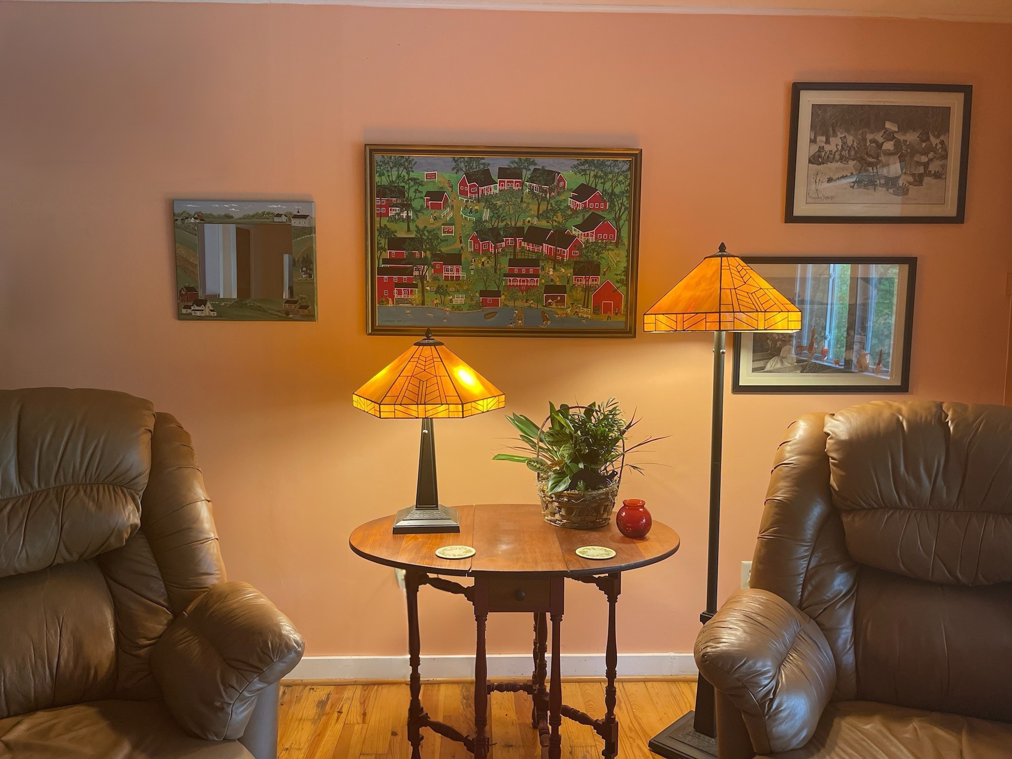 Big Pines living room with lots of local art of Otsego Lake and Hyde Bay and the history of the area.