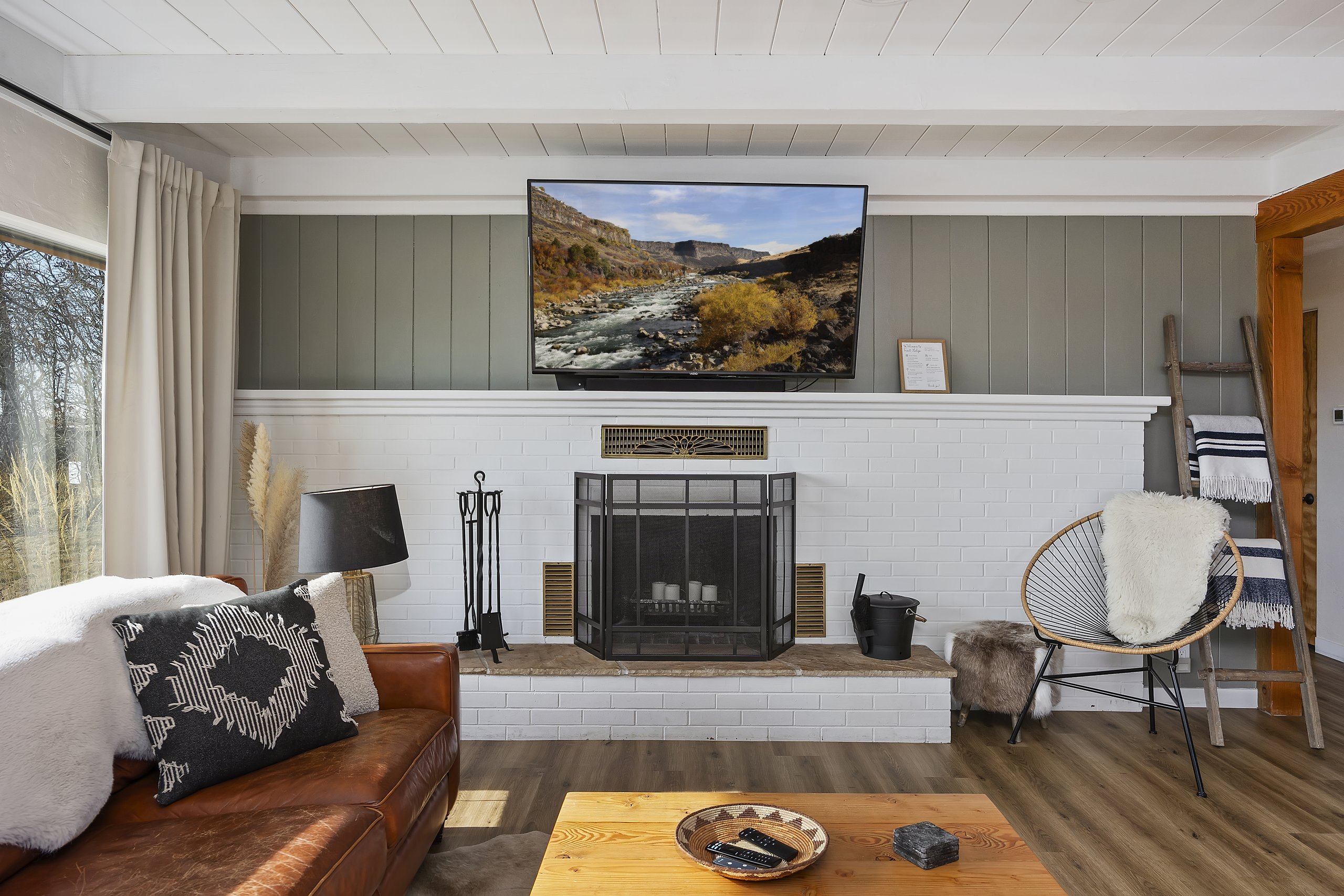 Unit 2 living room — bright, comfortable, with country views