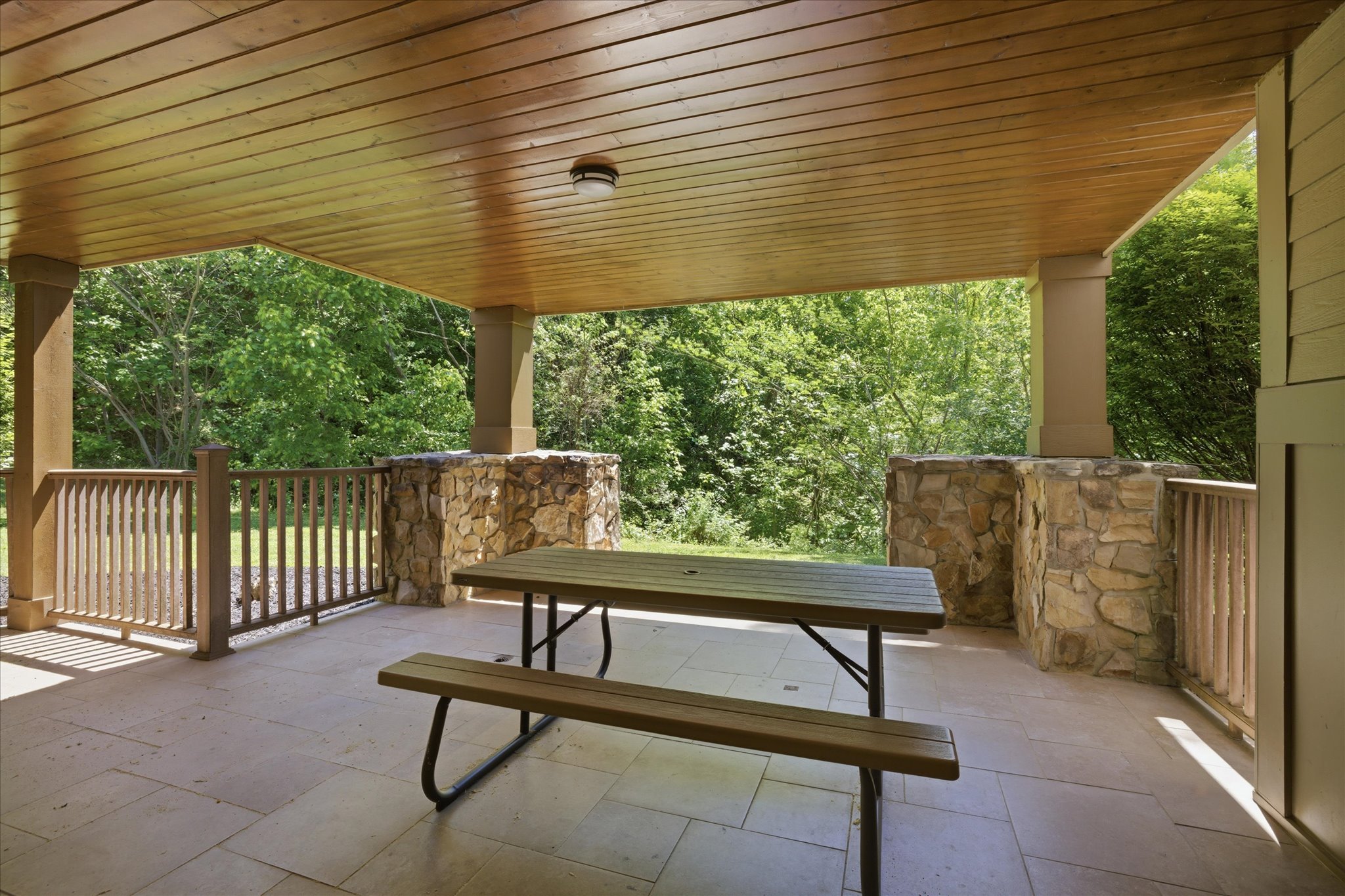 Step out onto the covered porch and enjoy fresh mountain air from your own picnic table, perfect for morning coffee or a relaxed meal outside.