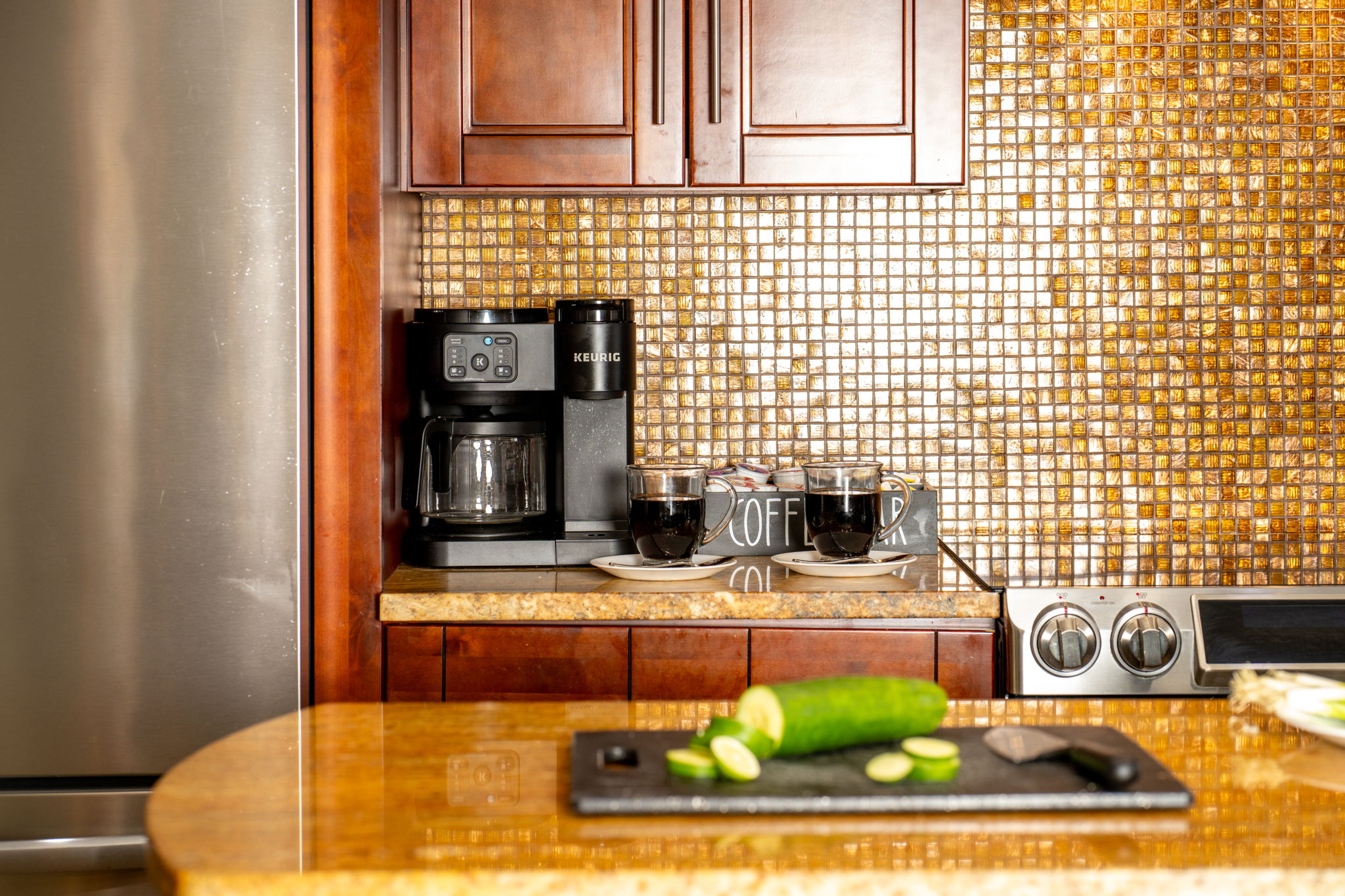 The spacious countertops provide plenty of prep space, while the coffee maker, toaster, and blender add convenience for your everyday routines.