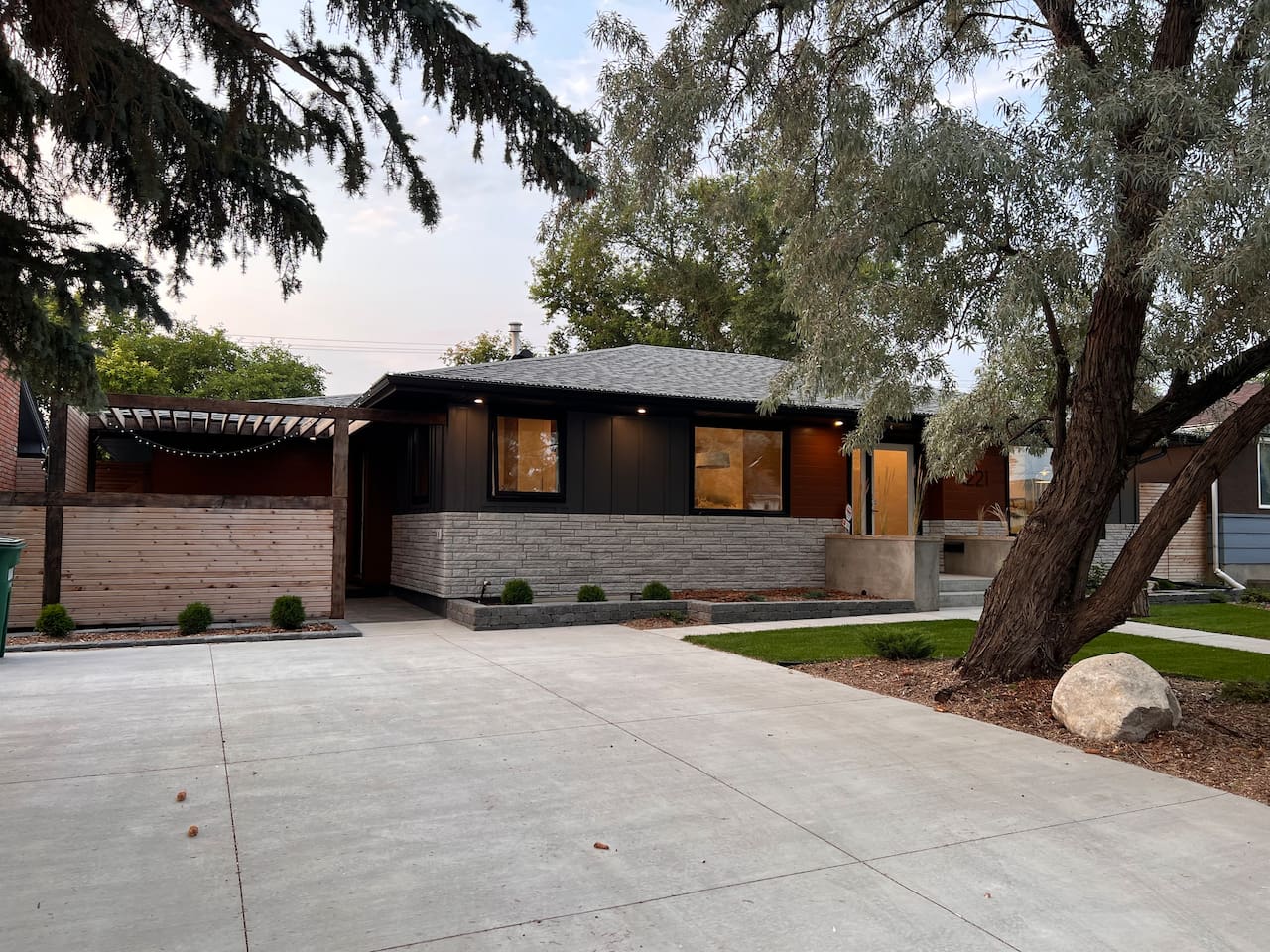 Exterior of the home — the guest suite entrance is through the pergola on the left.