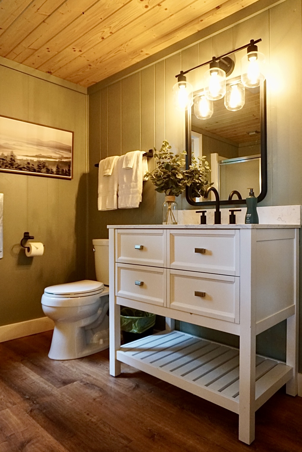 Spa-Like Bathroom: Enjoy modern fixtures and warm ambiance for a rejuvenating retreat!