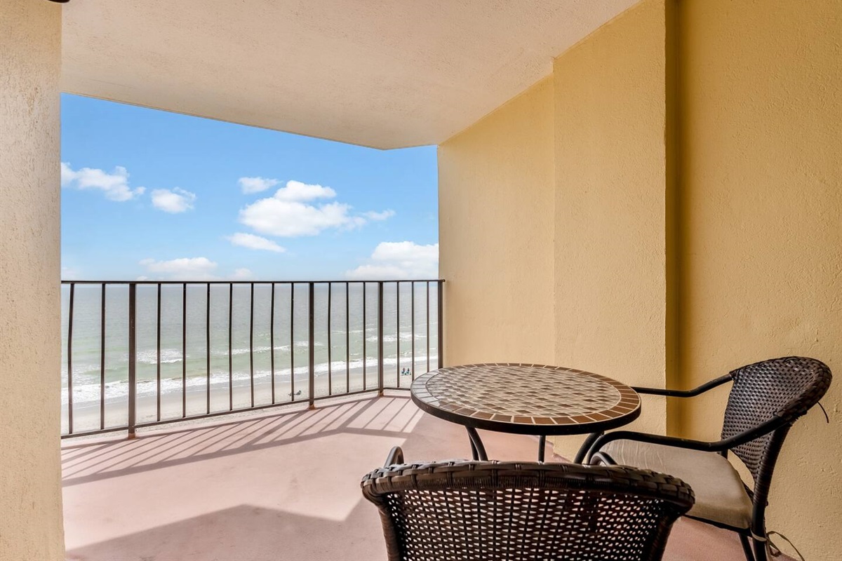 A private balcony with comfortable seating, offering stunning ocean views—an ideal spot to relax, unwind, and enjoy the tranquil beauty of the sea.