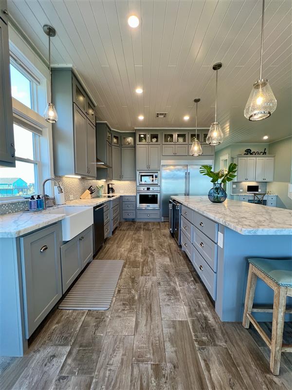 Crystal Paradise Kitchen: Bright, open kitchen featuring luxurious marble surfaces and generous space for gatherings.