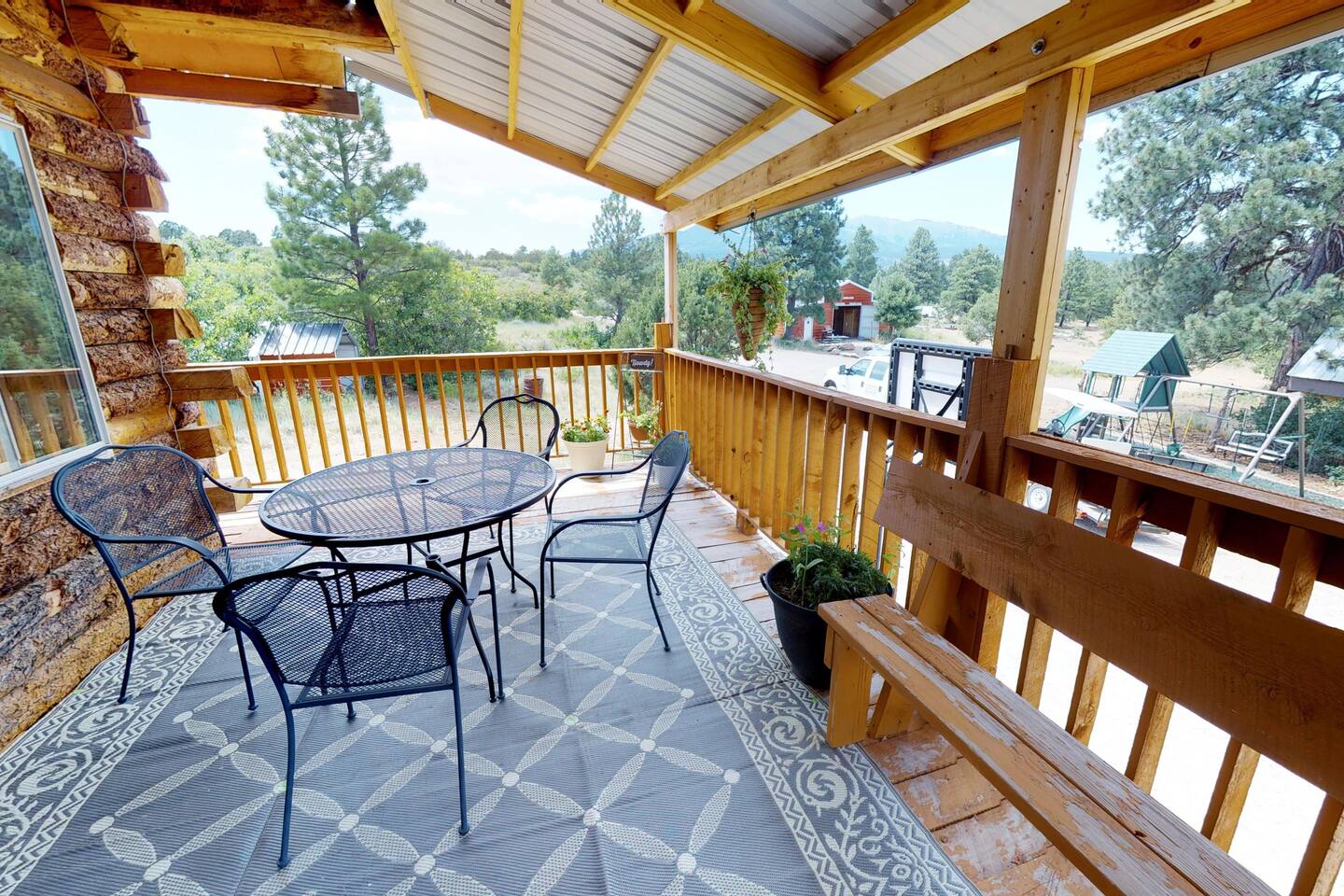 There is a wraparound porch on the main floor, with sitting areas at the front and back of the home.