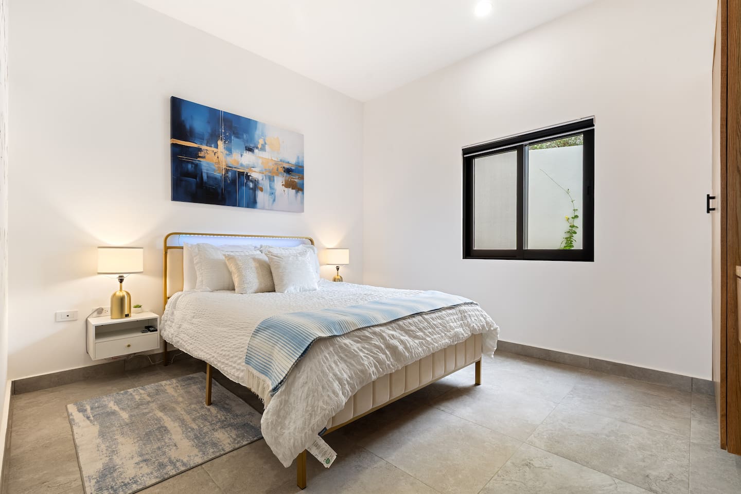 Unwind in this Cabo guest room with a plush queen bed, soft ambient lighting, blackout blinds, and panoramic mountain views. Enjoy a 55-inch smart TV, AC, and a breezy ceiling fan for ultimate comfort. Reserve now for your luxurious Mexico retreat!