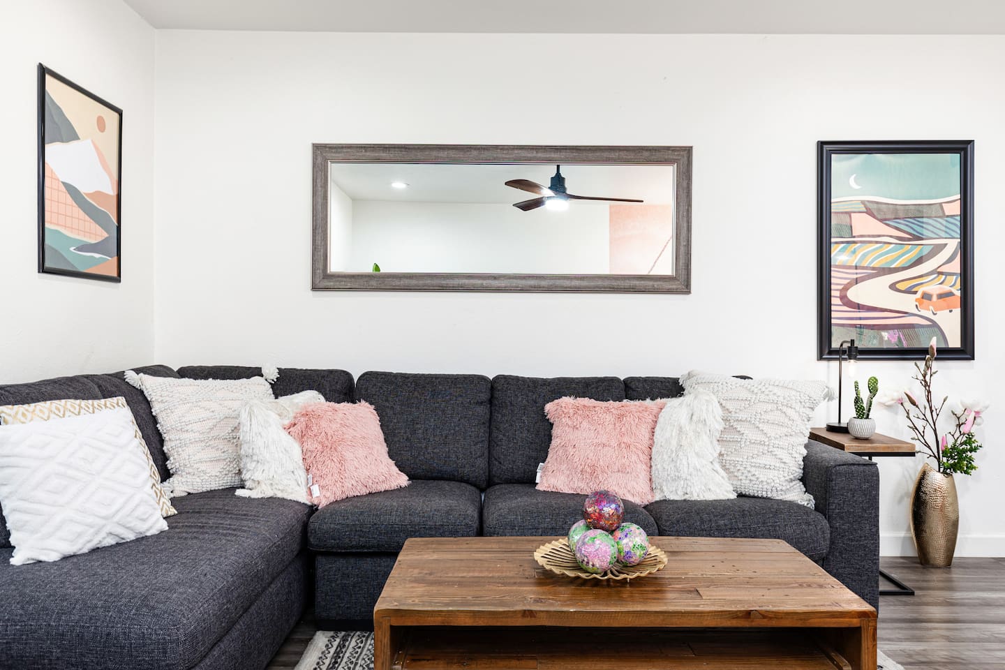 Enjoy soft throws, textured pillows, and calming colors that make this living room feel like home.

