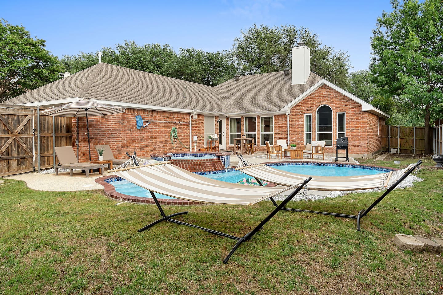 Double the relaxation, double the bliss. Our backyard oasis welcomes you with two inviting hammocks, perfect for moments of tranquil repose under the open sky.