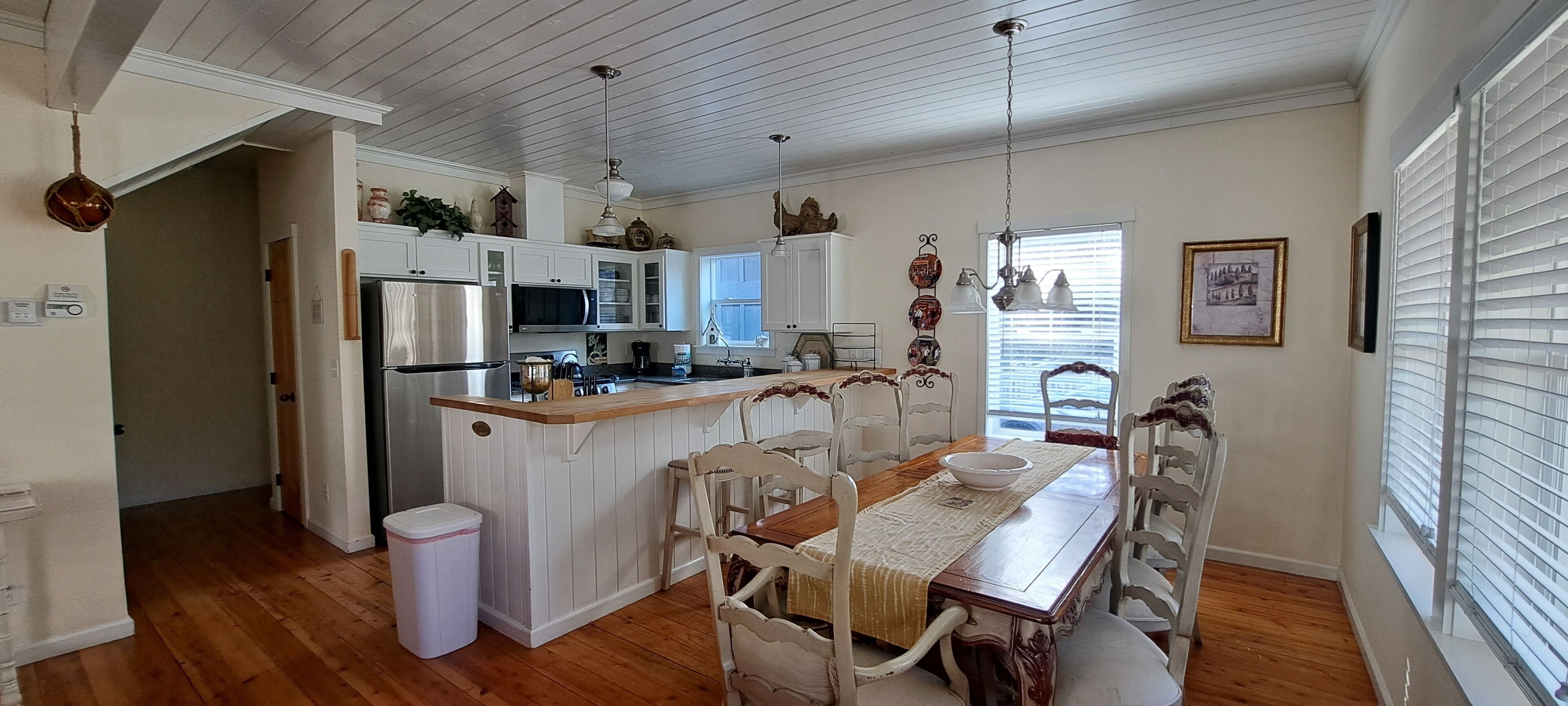 Gather around the French-Country table for 8, with additional seating at the kitchen island for family and friends.
