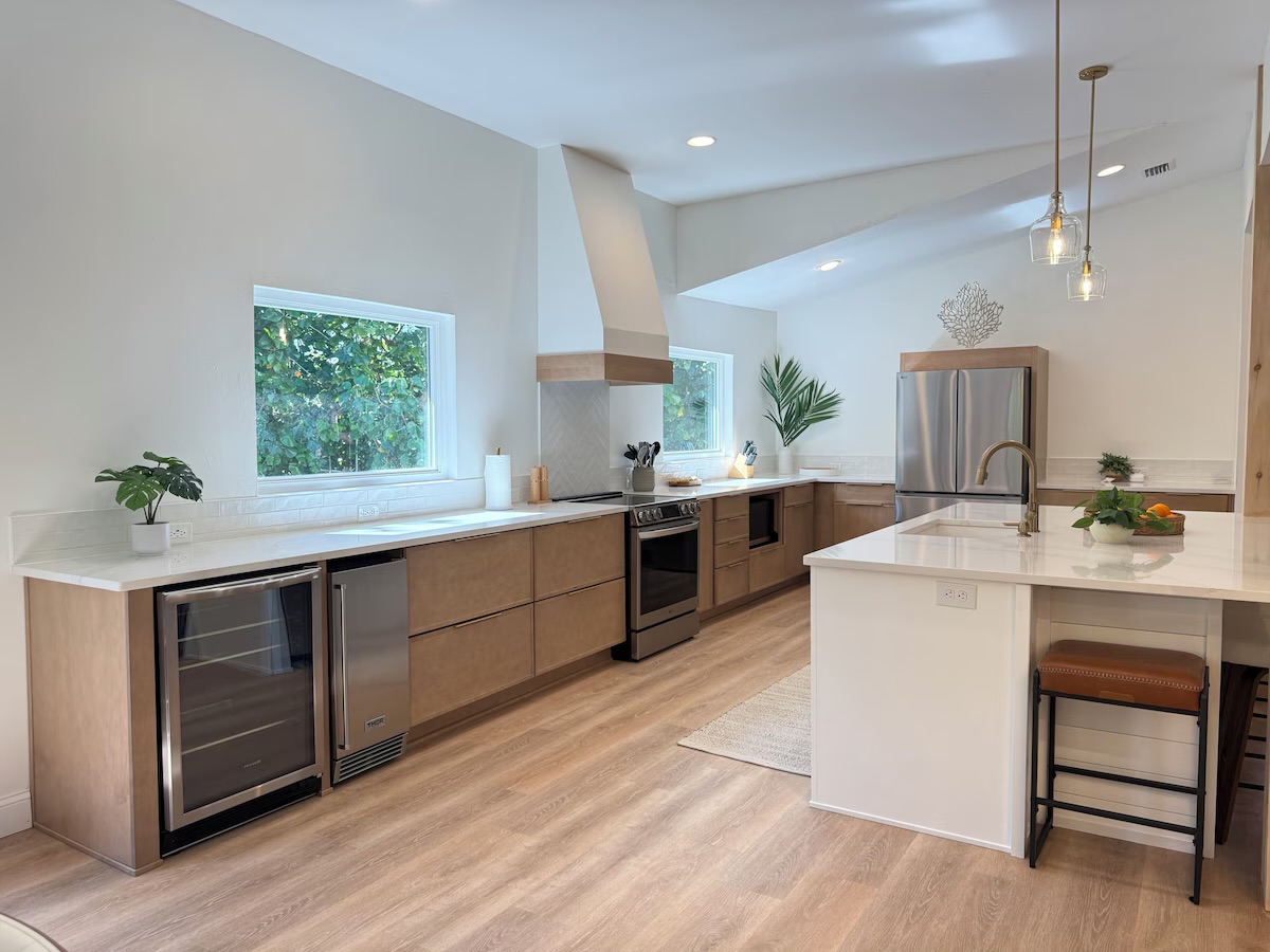 Meticulously designed kitchen with high end appliances and gold-veined Quartz