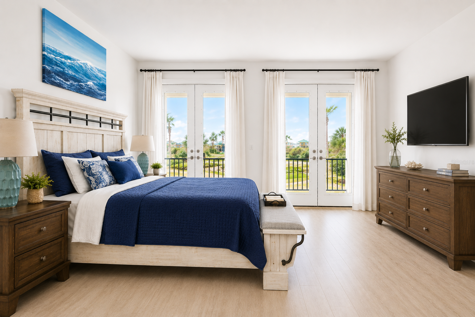 Wake to sunlight and palm-tree views in this airy coastal suite, where crisp navy-and-white calm meets doors that open to the breeze. It's the room everyone secretly hopes to claim—made for gentle mornings and the very softest of goodnights.