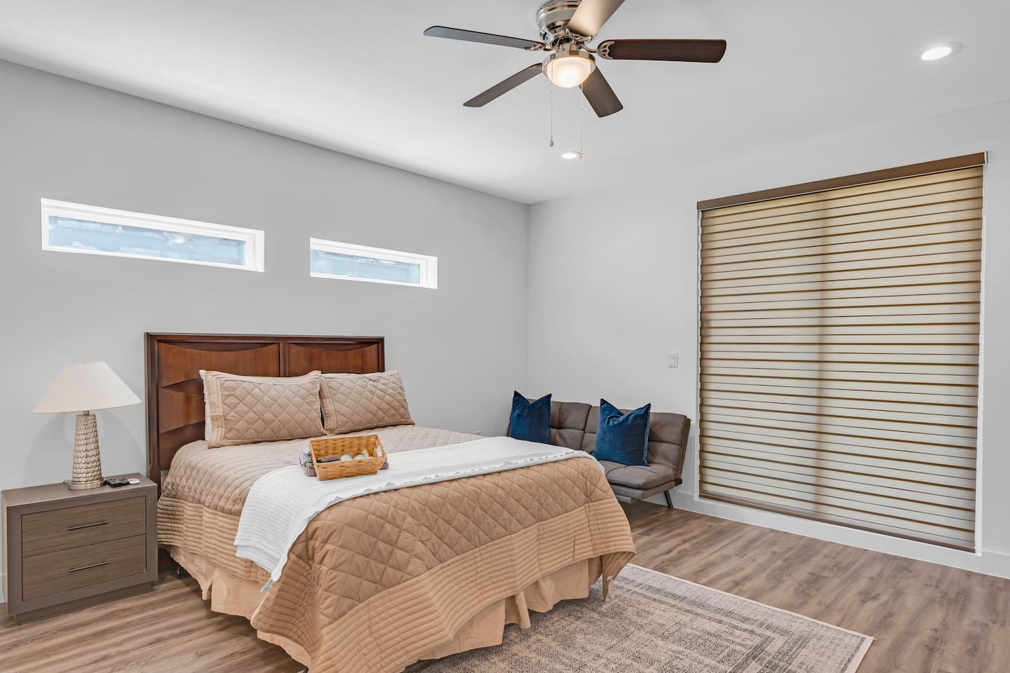 Spacious primary bedroom designed for comfort and relaxation with room darkening shades.