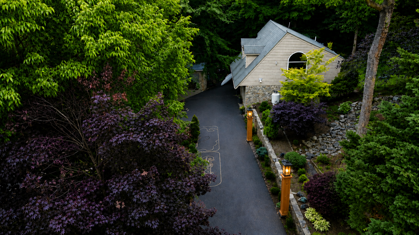 Aerial view of Guesthouse nestled in forest near Japanese Garden