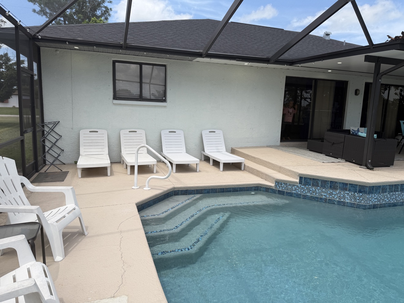 Pool deck with lounge chairs