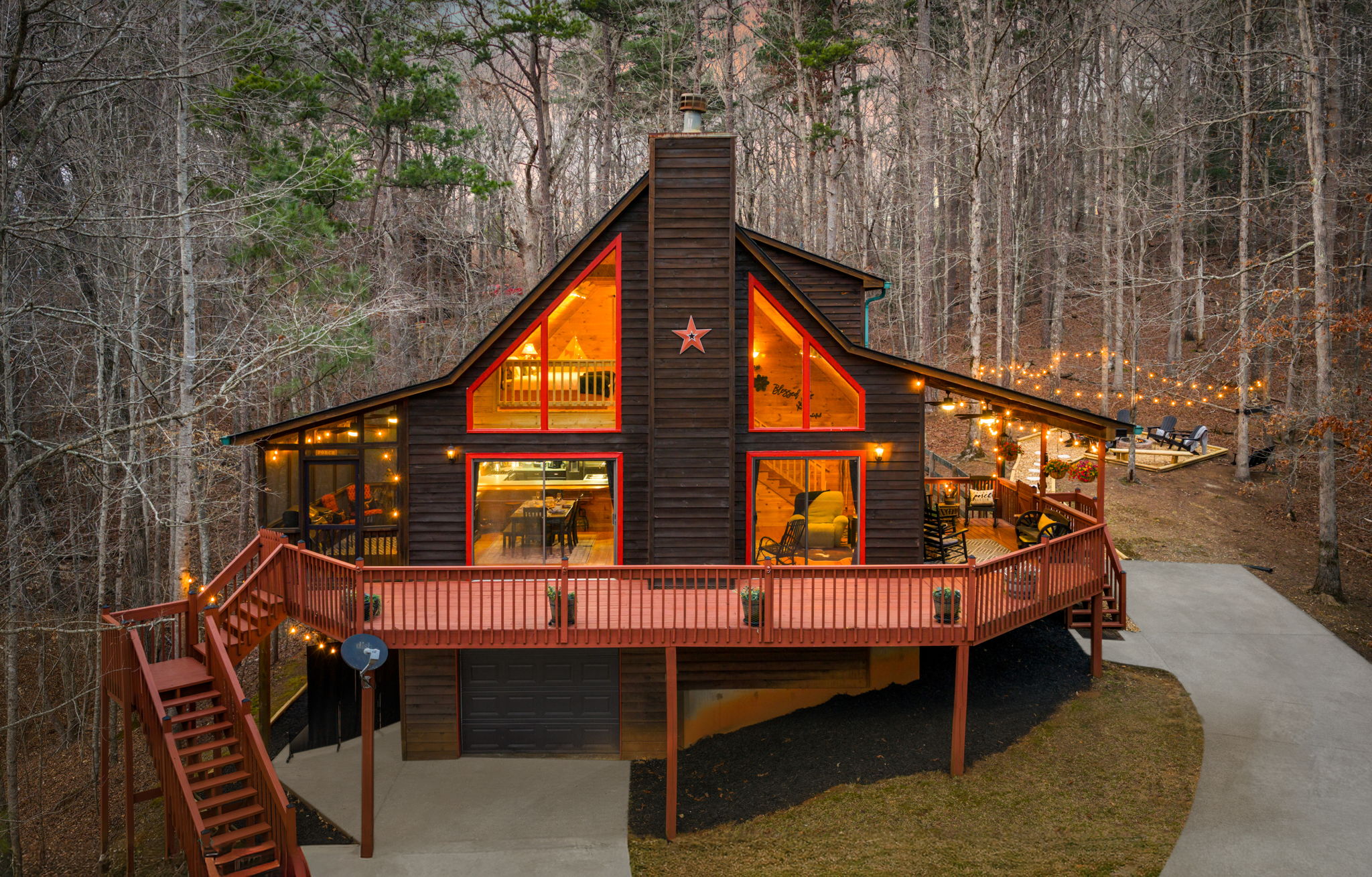 Surrounded by the natural landscape, the glowing home stands out beautifully against the darker surroundings.