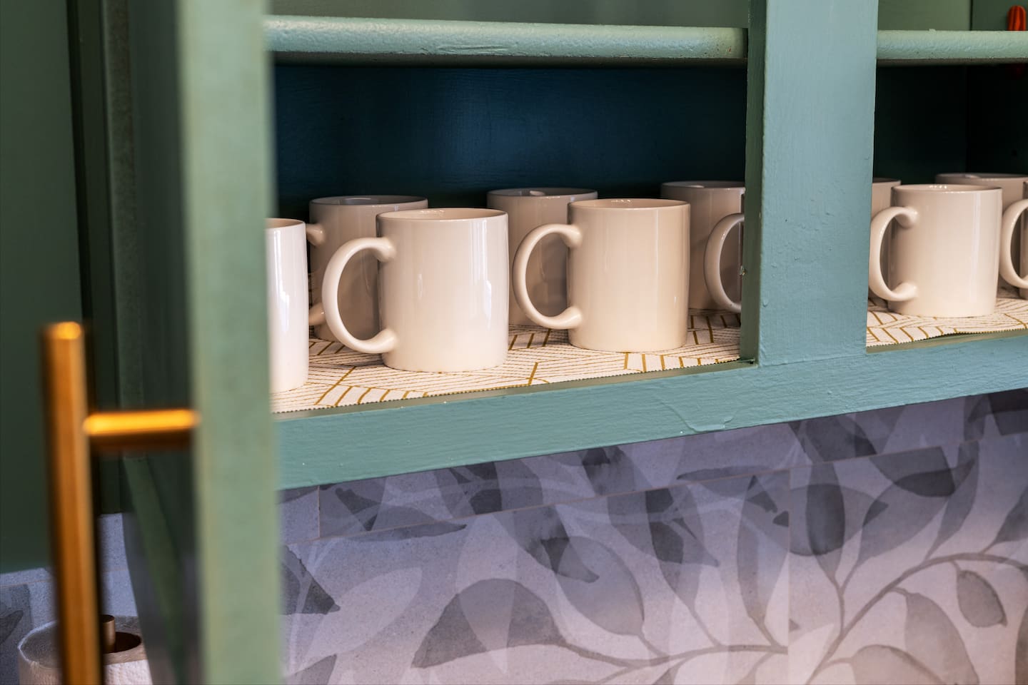 Plenty of mugs, wine glasses, and cups — perfect for morning coffee or evening cocktails by the pool.