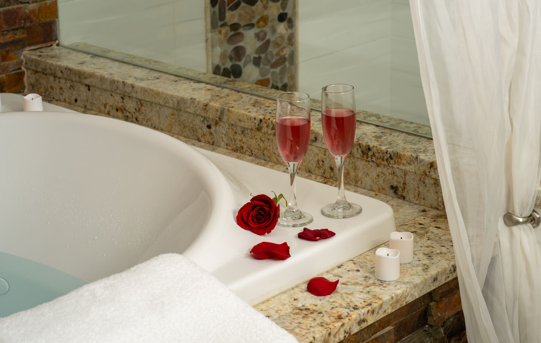 The bathroom is complete with his and hers sinks and a large vanity, providing ample space and privacy—making it a true ensuite sanctuary.