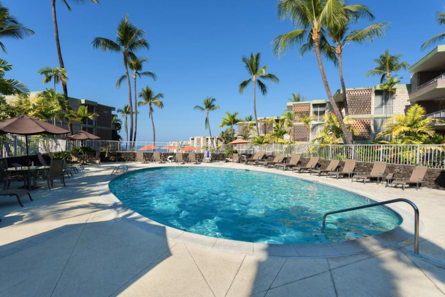 Relax by the sparkling oceanview pool surrounded by swaying palms and plenty of loungers for soaking up the Kona sunshine.