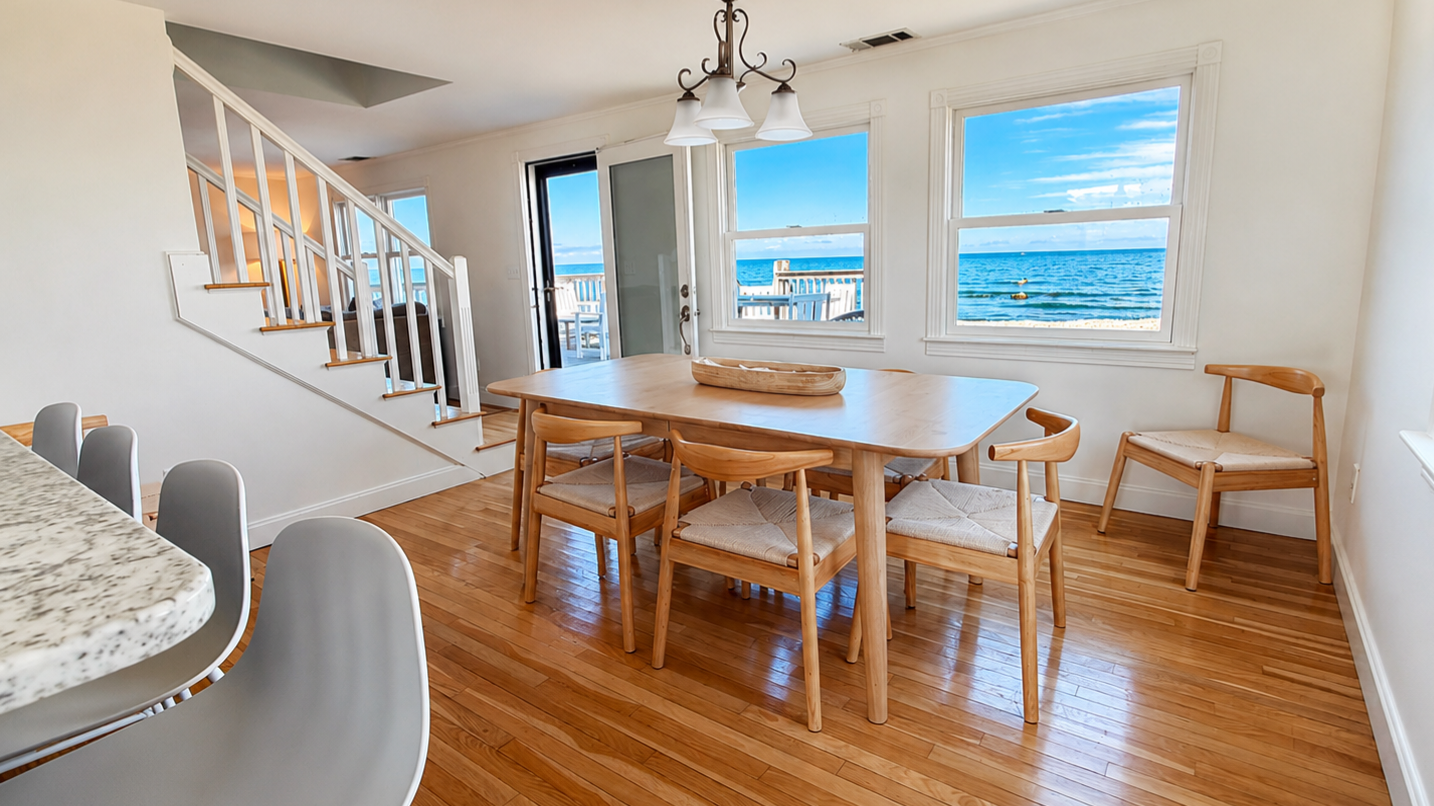 Gather around the dining table while enjoying beautiful ocean views just beyond the windows.