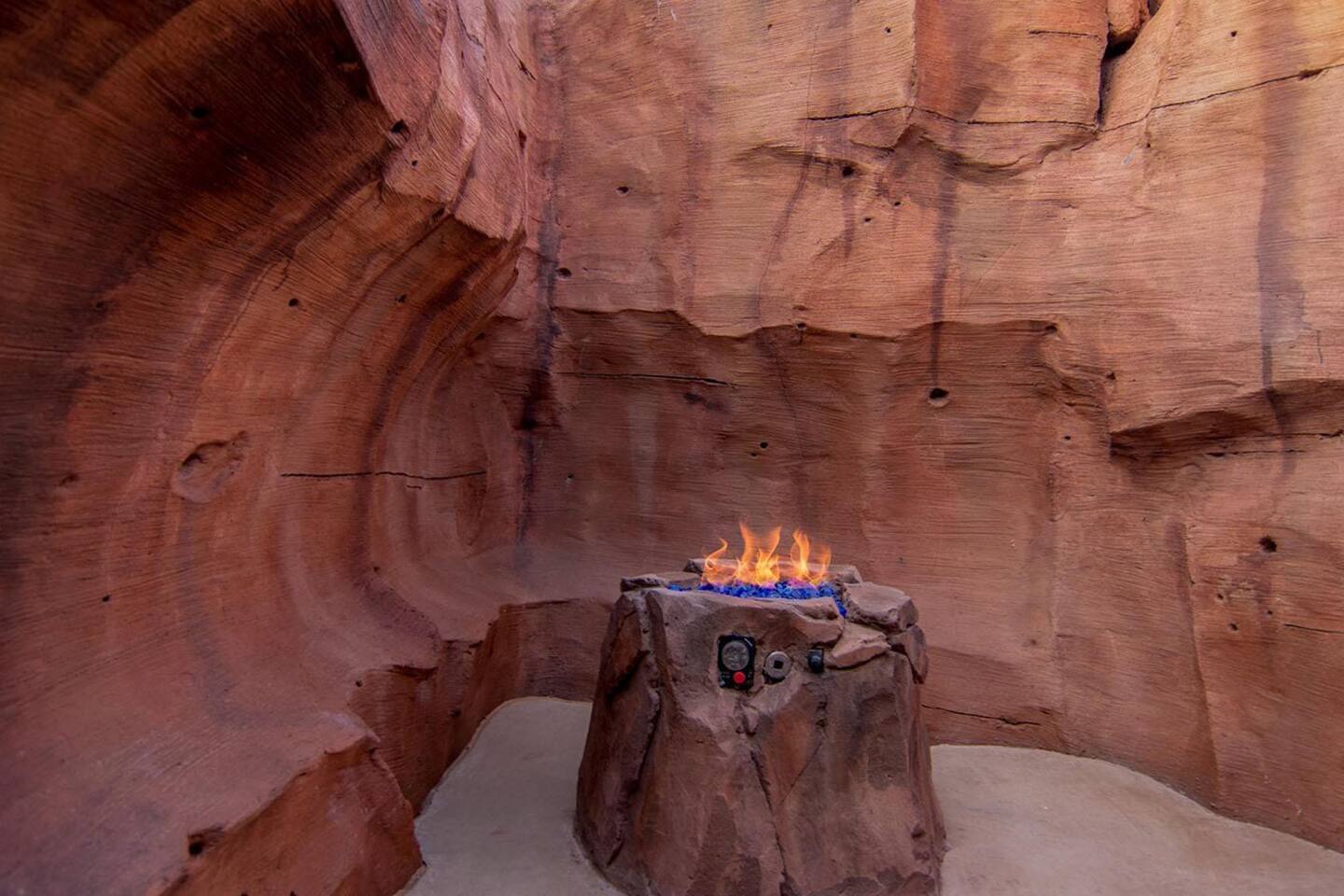 Poolside slot canyon with hidden fire pits inside