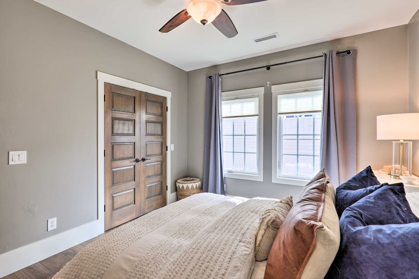 Soft light and rich wood tones make this bedroom a peaceful place to land after a day of adventure.