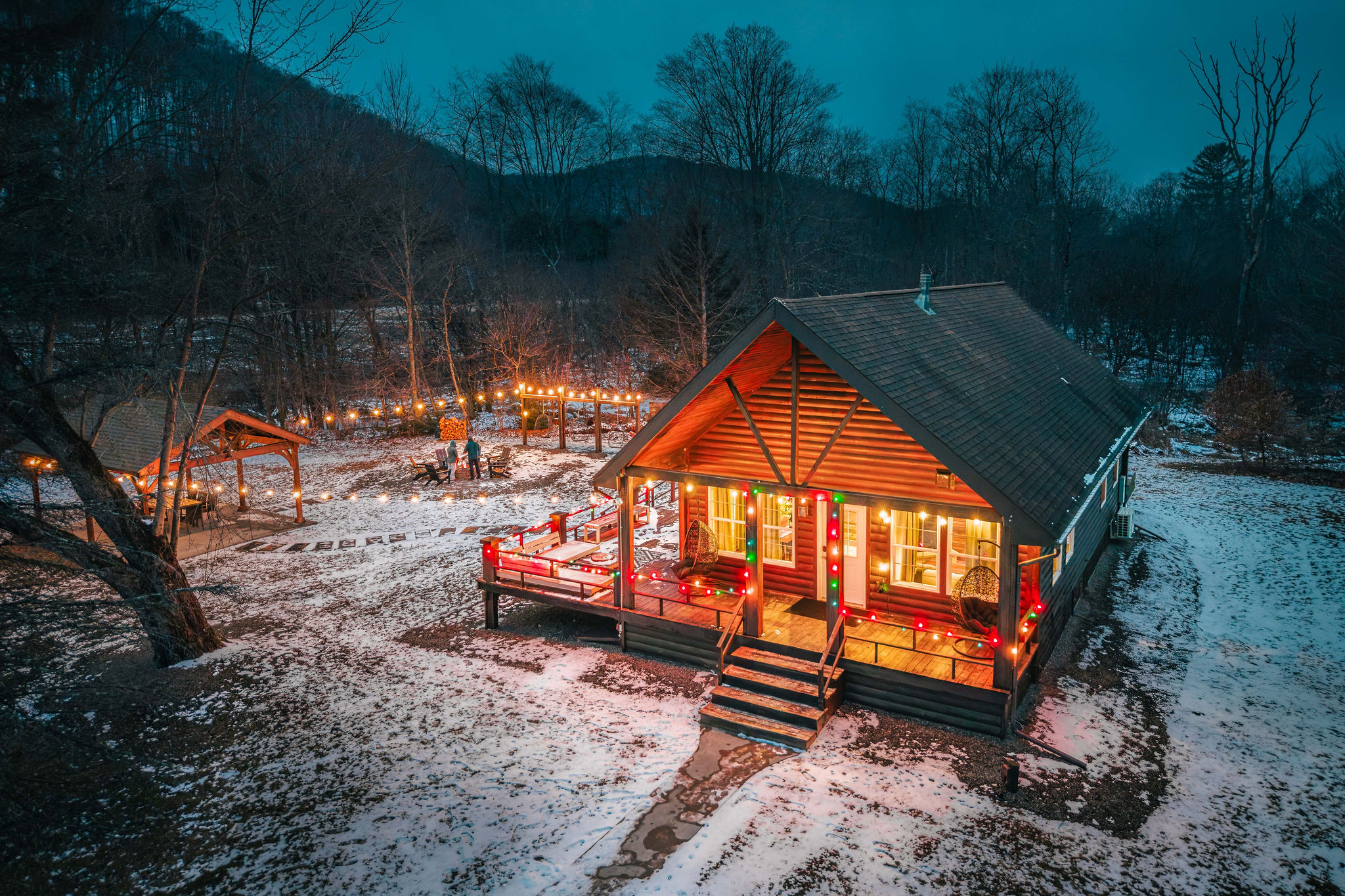 Your private winter retreat—glowing cabin lights, fire pit nights, and total seclusion under the stars.
