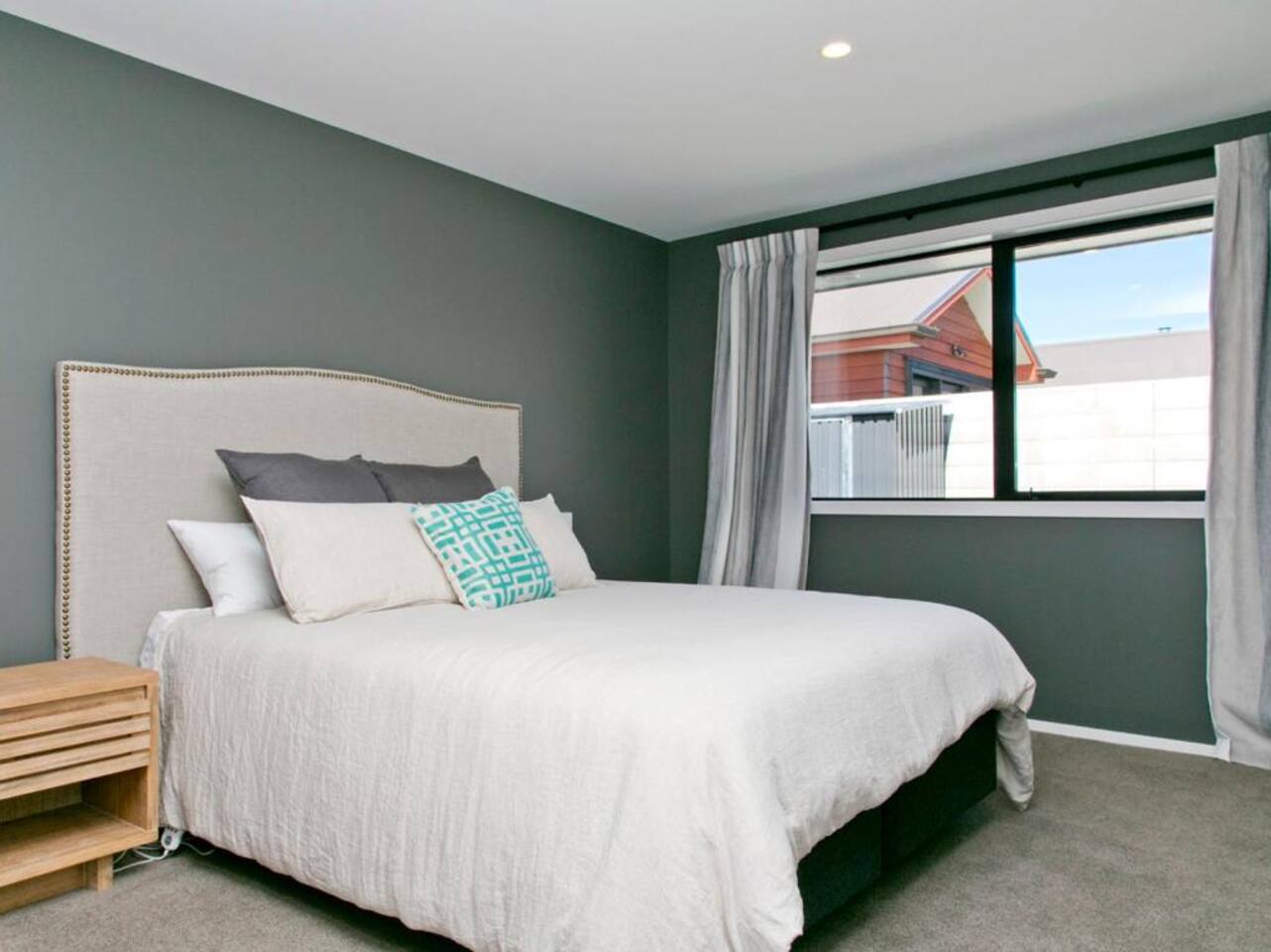 Main Bedroom 2 which also has an Ensuite and TV on the wall 