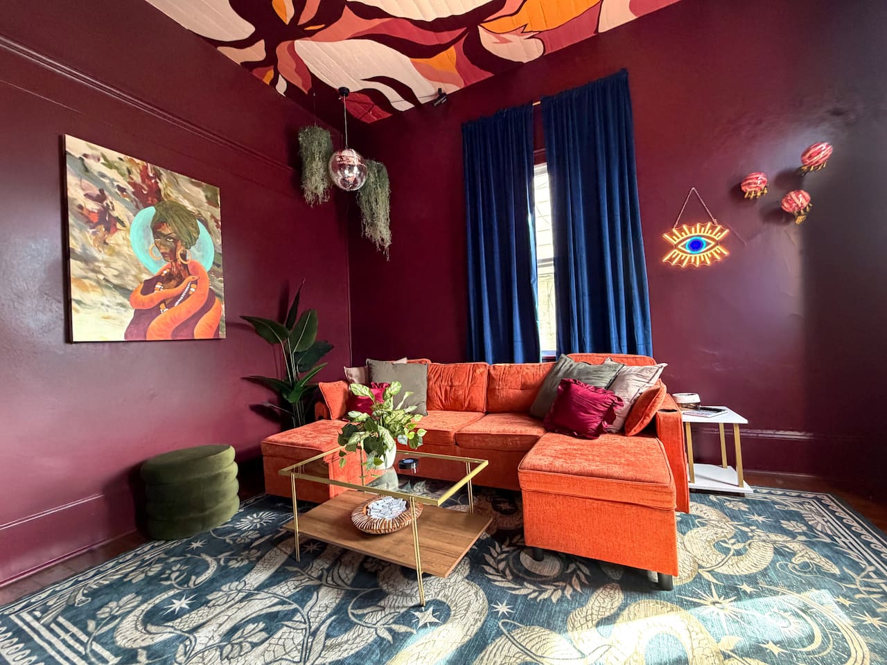 Stylish lounge space with plush velvet seating, moody walls, and bold New Orleans design.  Perfect for relaxing, cocktails, or planning your night in the nearby French Quarter and Marigny nightlife district. 