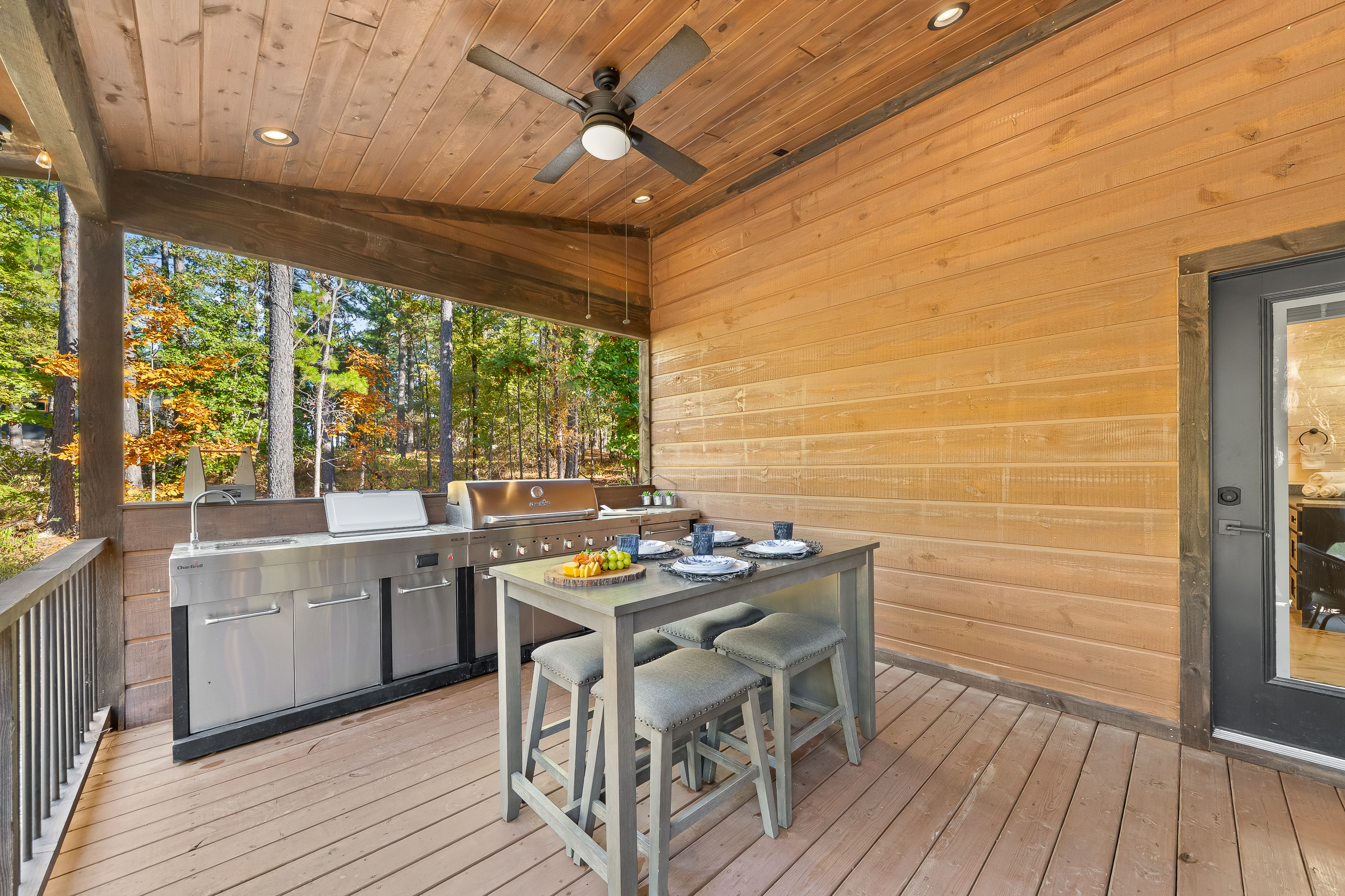 Chef style outdoor kitchen with built in grill and bar height table, ideal for morning coffee or evening cocktails while you cook.