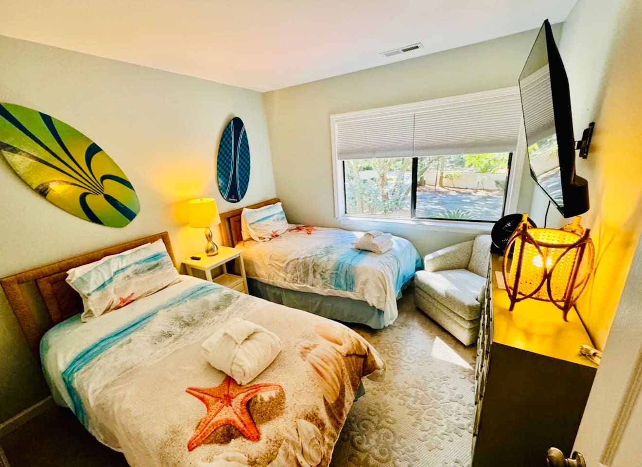 Bedroom with two beds and beach decor