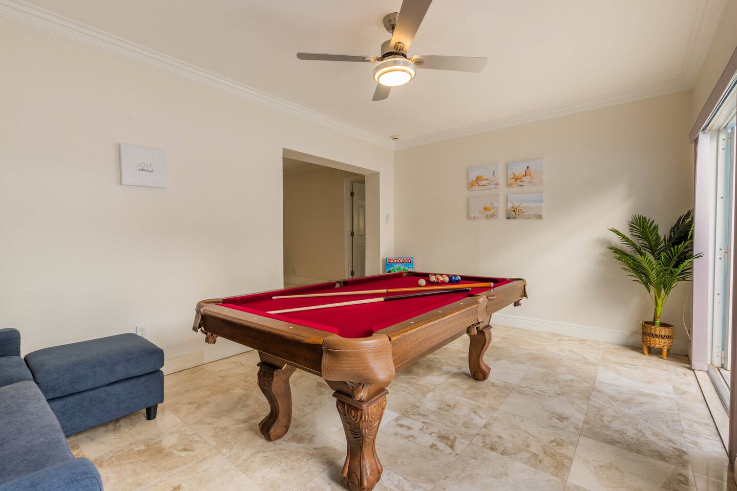 The Florida Room sits off the Living Room. There is direct access to the exquisite patio deck. The Florida Room is a place to have fun and relax. With a large Pool table, games (Monopoly, UNO, playing cards), pull out L-shaped sofa bed and two double doors