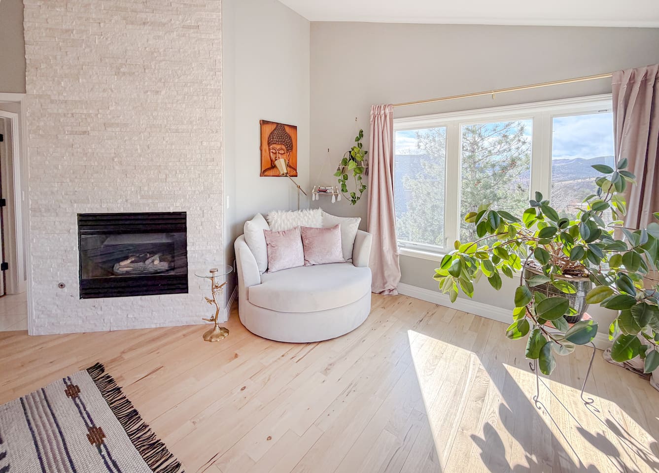 The luxurious master bedroom with charming corner loveseat creating the perfect spot to curl up with a book or morning coffee enjoying the sunshine and views.