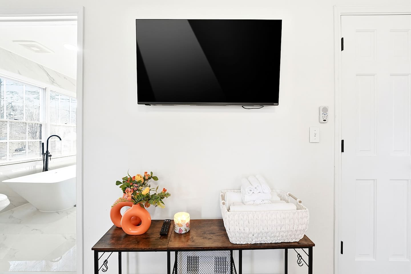 Conveniently located left of the glass front entry, this cozy bedroom offers a king bed and features a smart TV. This room includes 2 full-size towels, 2 hand towels, and 2 washcloths provided for your comfort.