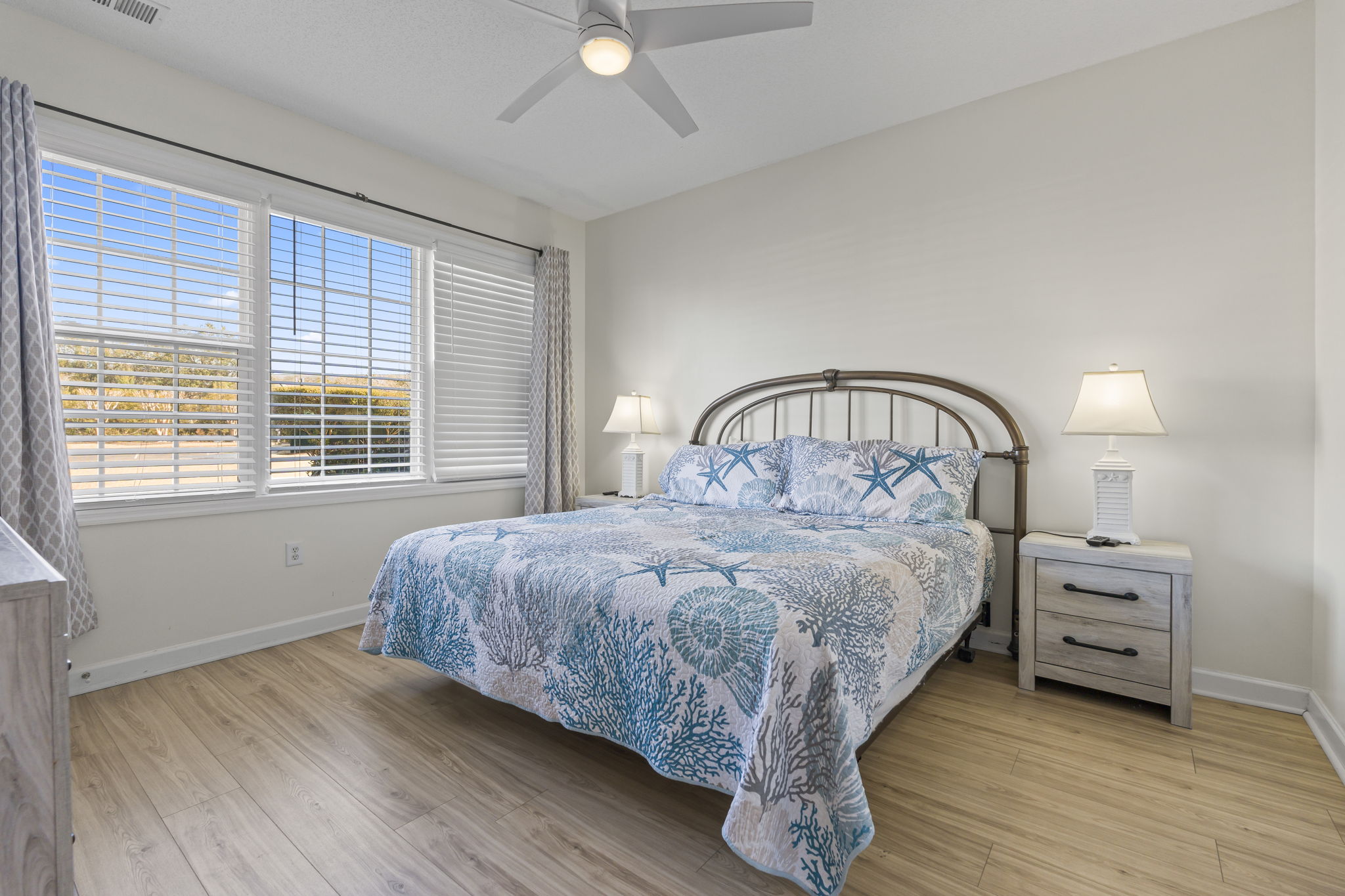 Master Bedroom with large window, king bed, ensuite bathroom