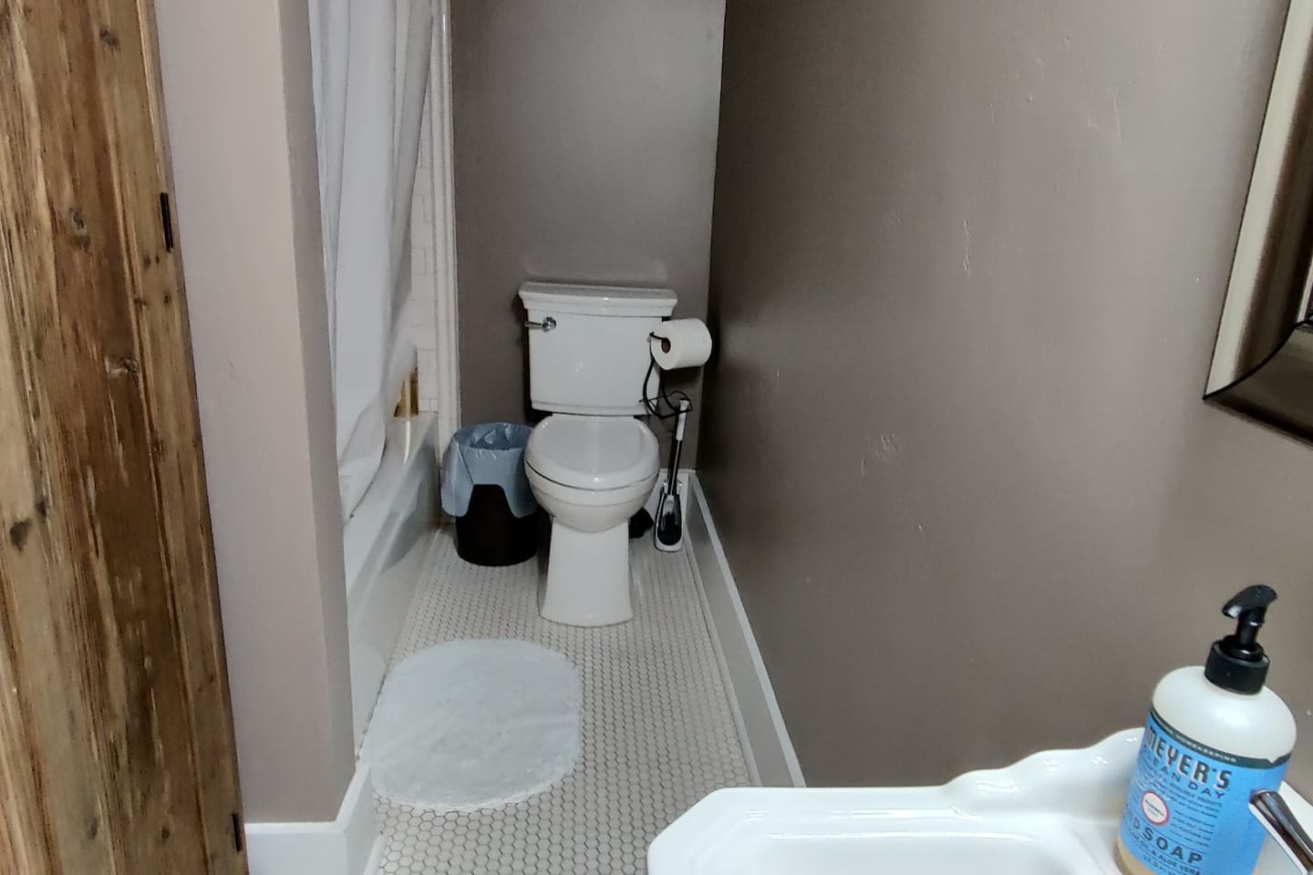 Main floor bathroom with shower and bathtub. 