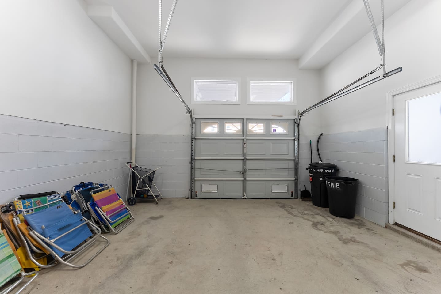 Private garage with private access and multiple beach chairs for guest usage. 