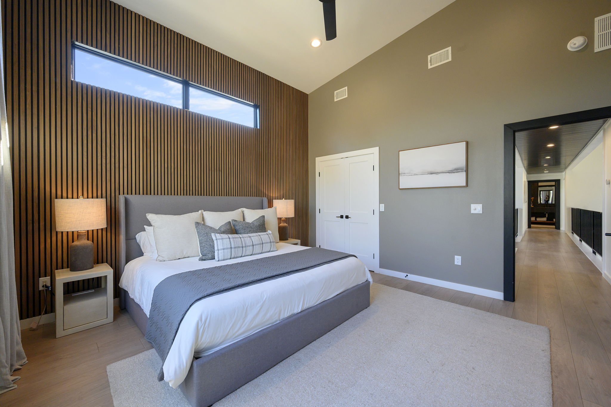 King Suite 2 - Large and spacious suite with teak wood paneling, designer finishes, smart TV, premium king mattress, and luxury bedding. Includes stunning views of the hardwood forest. 