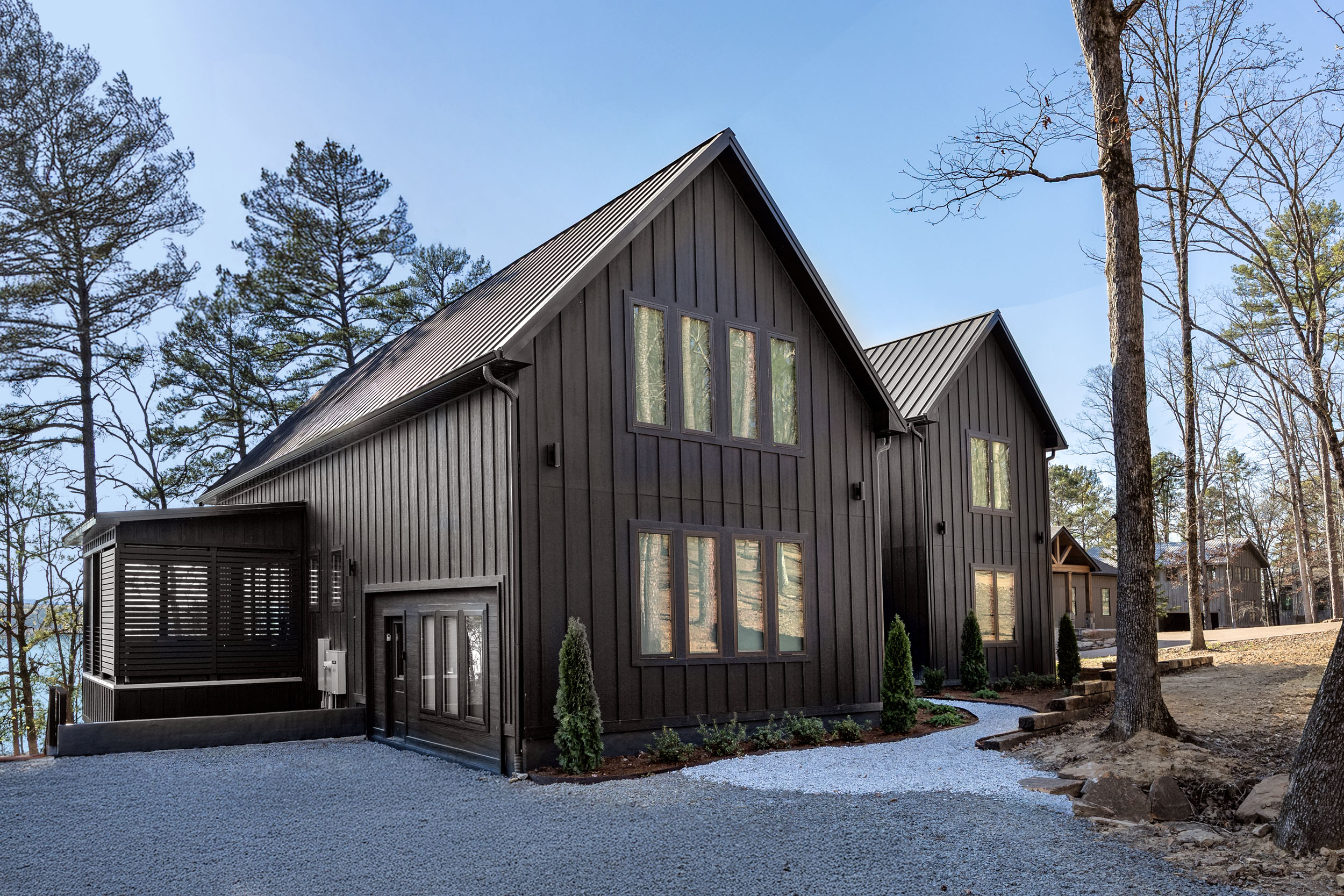 The bold, modern exterior of Sunset Cove blends seamlessly with the natural beauty of the Ozarks—striking, secluded, and surrounded by adventure.