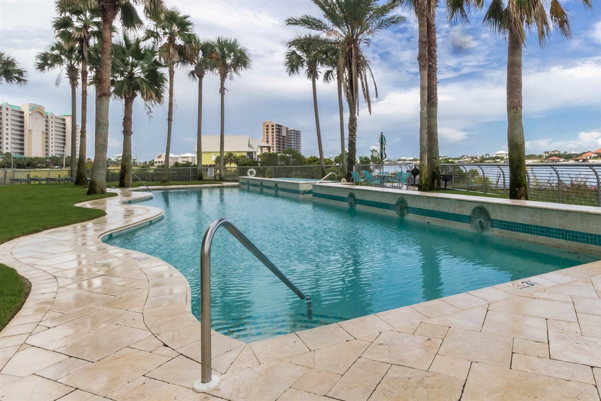 The stunning outdoor pool at Bella Luna offers a serene oasis with breathtaking views of the tranquil Ole River.