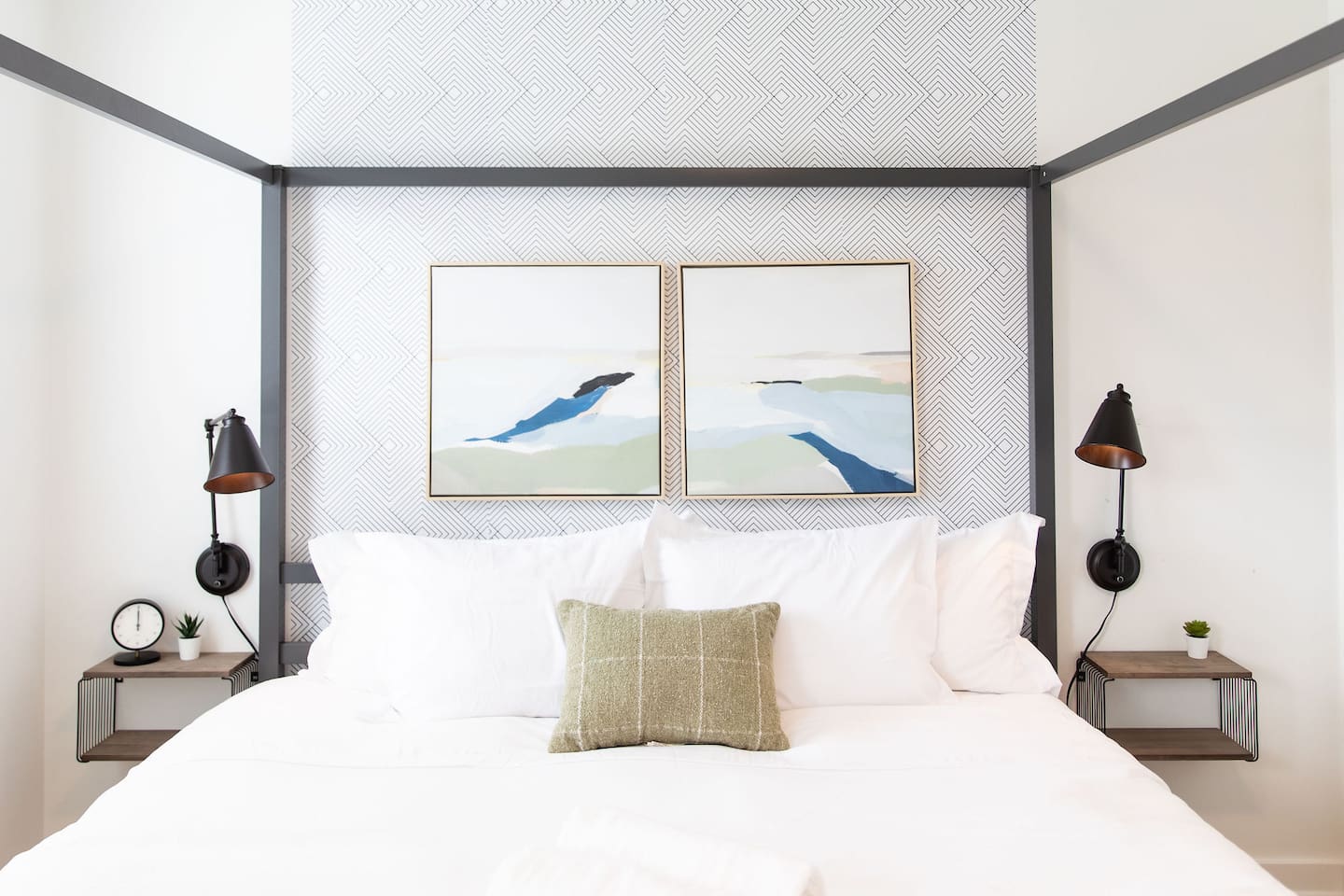 Serene bedroom with a calming white interior, featuring simple yet elegant décor that creates a peaceful and restful retreat.