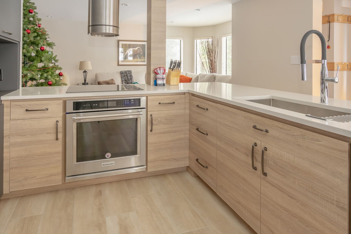 Bright modern, open concept kitchen is great for family and group gatherings. Featuring Wolf Cooktop, built-in wall oven,  commercial under counter fridge and integrated freezer. Full renovation completed Jan 2019