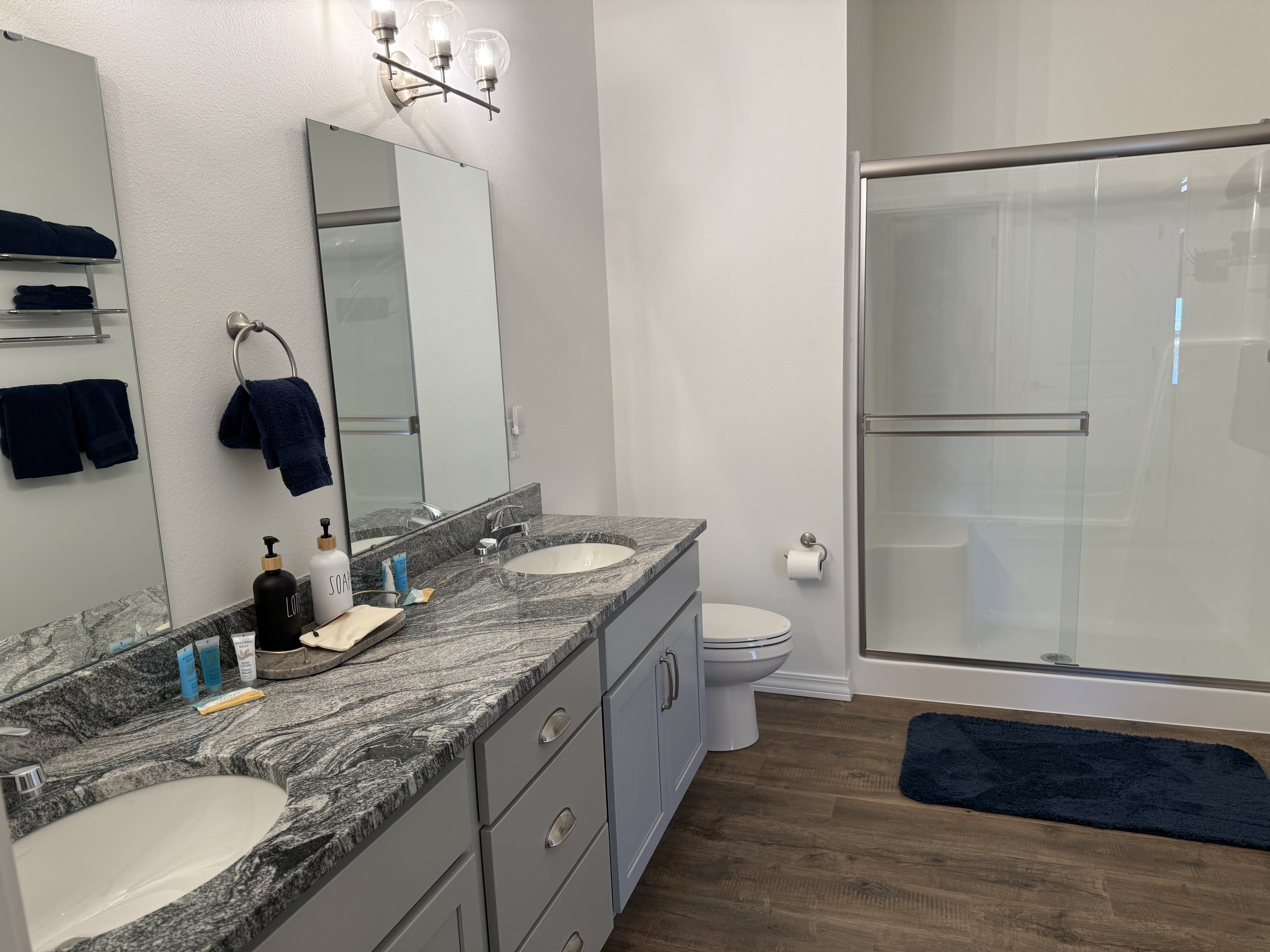 En-suite Master Bedroom Bathroom with closet and dual sinks. Huge walk in shower with glass door
