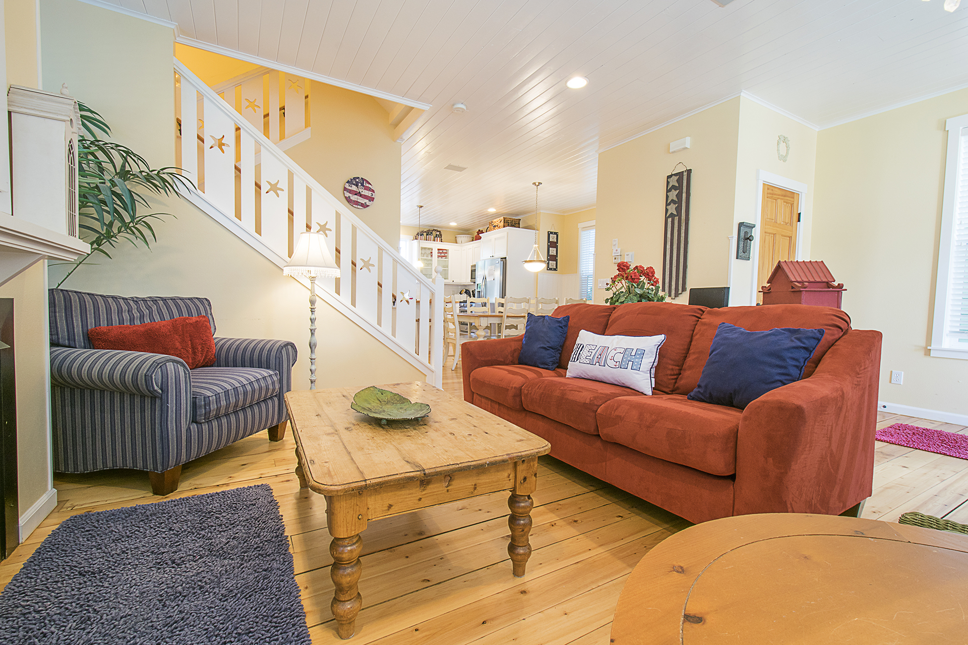 Experience classic beach cottage style — wood floors, white-painted wainscoting, and décor that complements the coastal vibe.