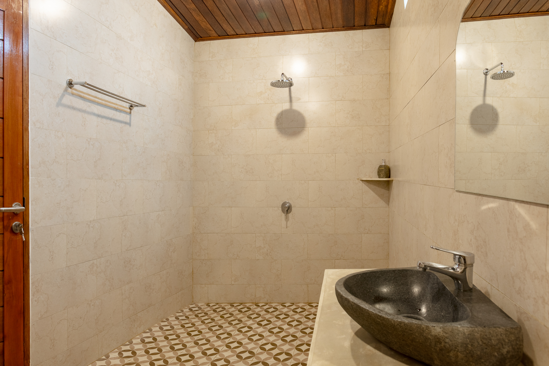Your spacious private bathroom, featuring a large, comfortable walk-in shower.